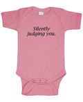 Silently Judging You — Pink Infant Bodysuit — front