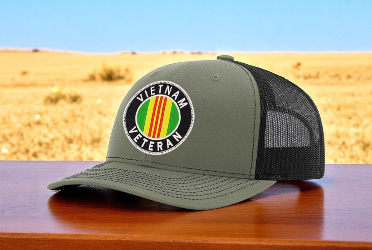 Vietnam Veteran Oval — Vietnam Veteran Oval Logo - Army Green and Black - Standard Bill Embroidered Trucker Hat — existing lifestyle 1