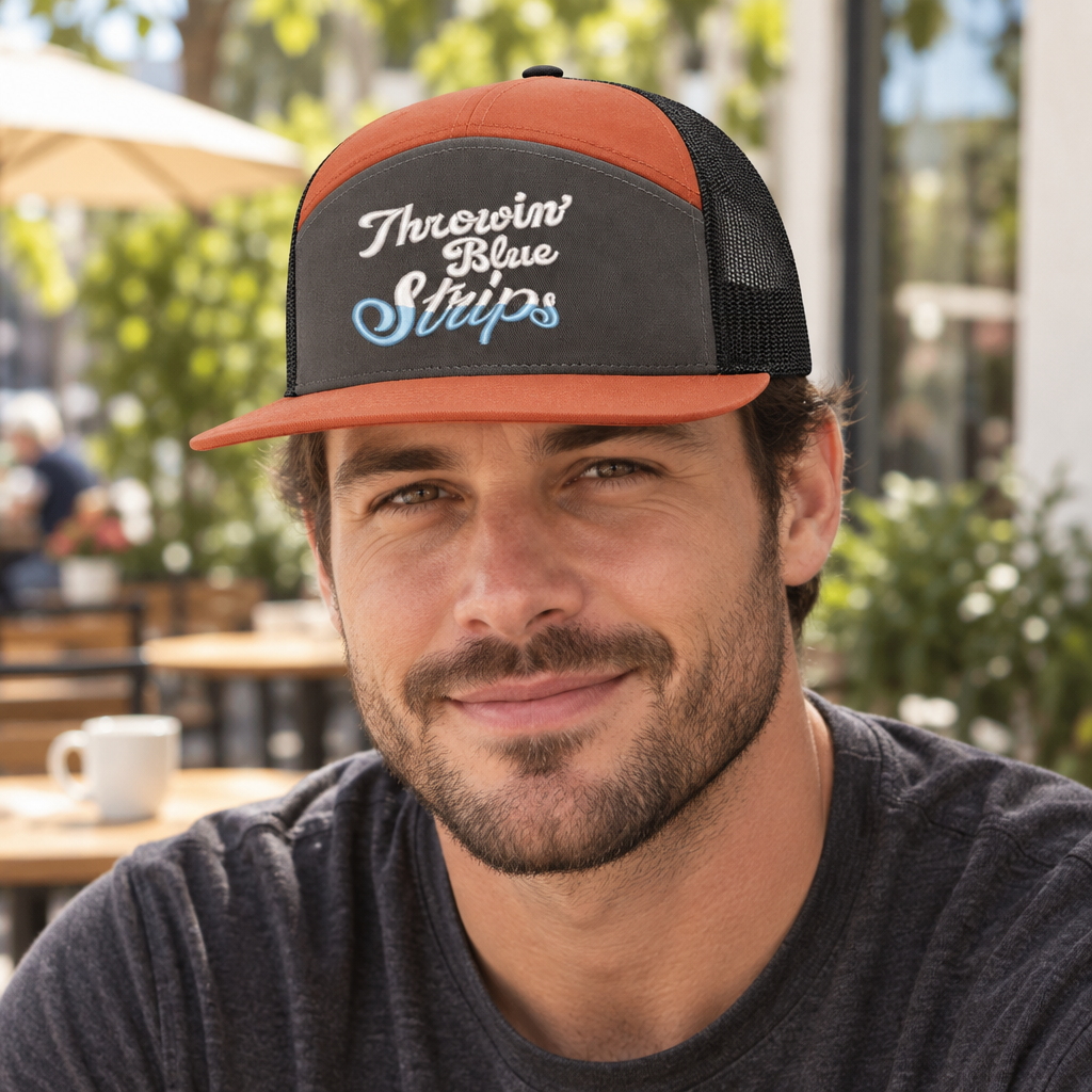 Throwin Blue Strips — Throwin’ Blue Strips - Burnt Orange Charcoal and Black - 7 Panel Flat Bill Embroidered Trucker Hat — lifestyle hero