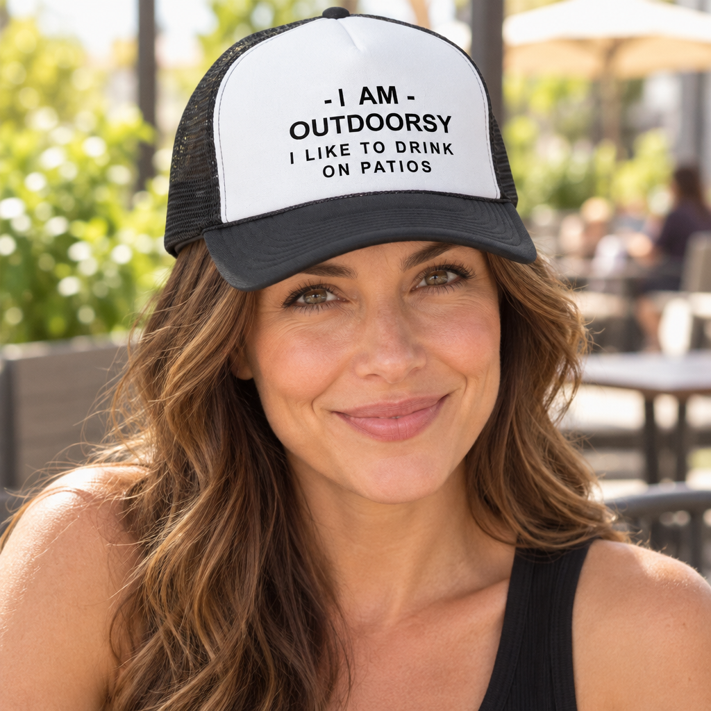 I Am Outdoorsy I Like to Drink on Patios — Black Trucker Hat — lifestyle hero